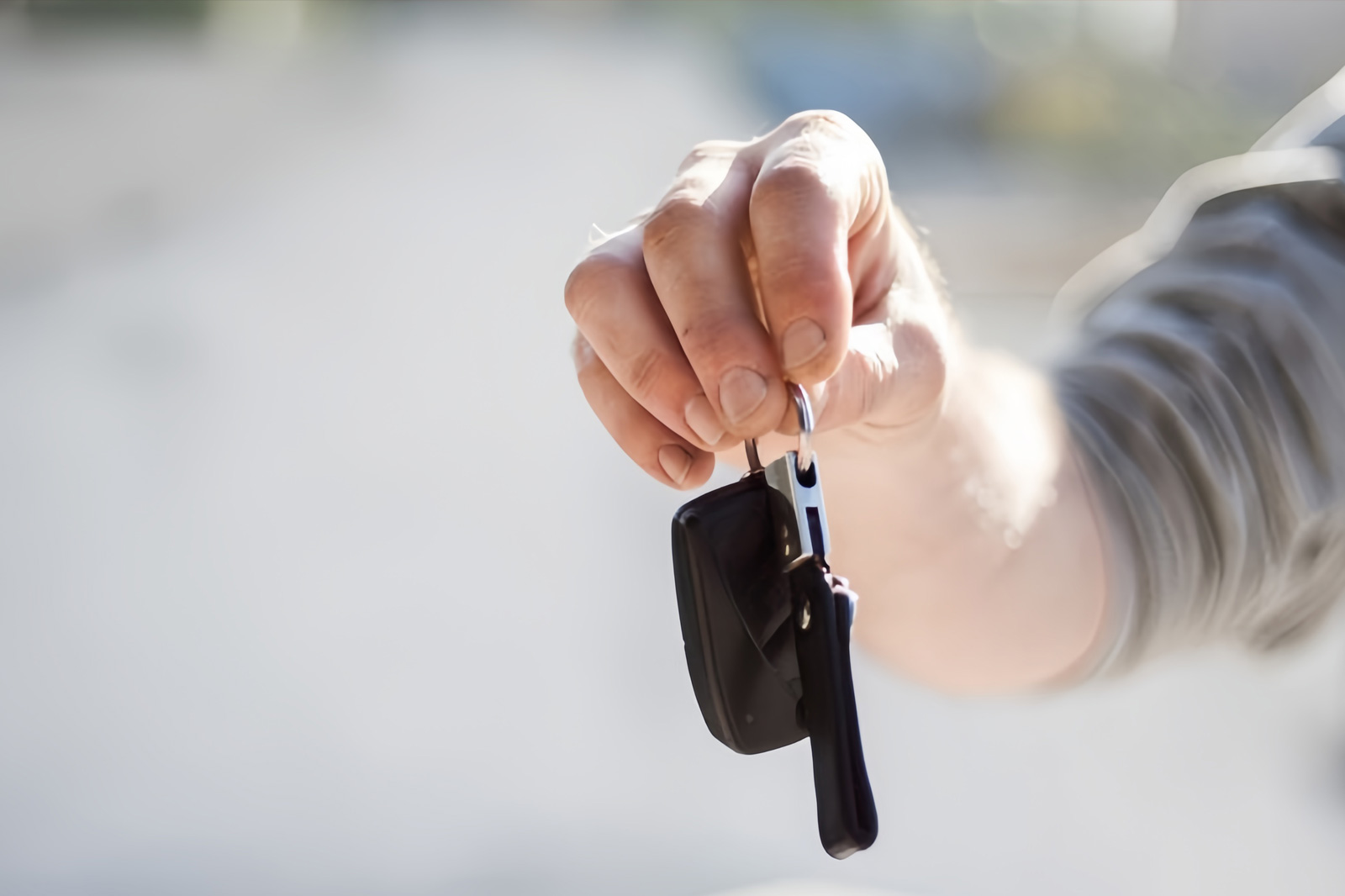 Image of a hand holding car keys